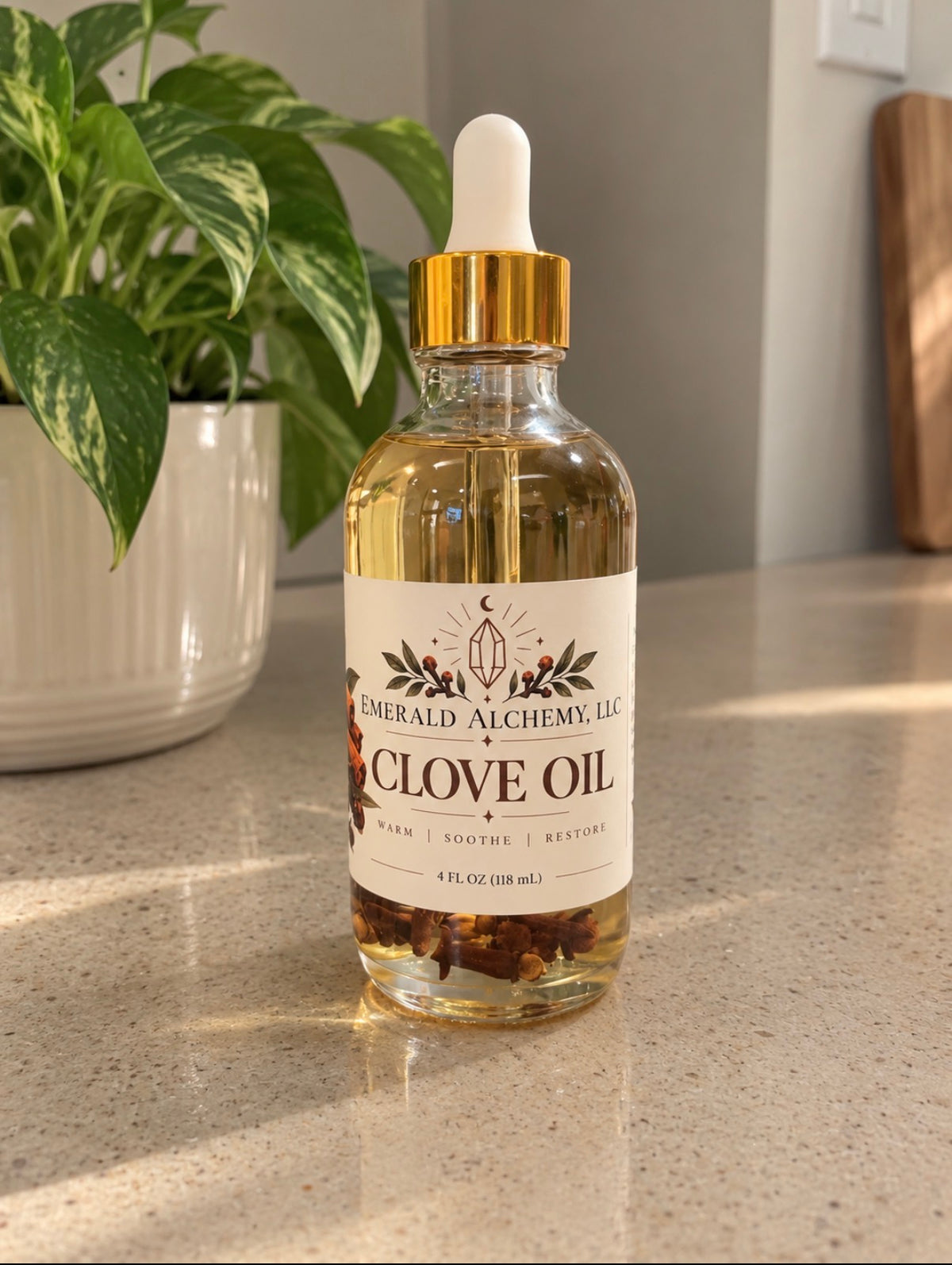 Clove body and massage oil in a 4 oz glass dropper bottle