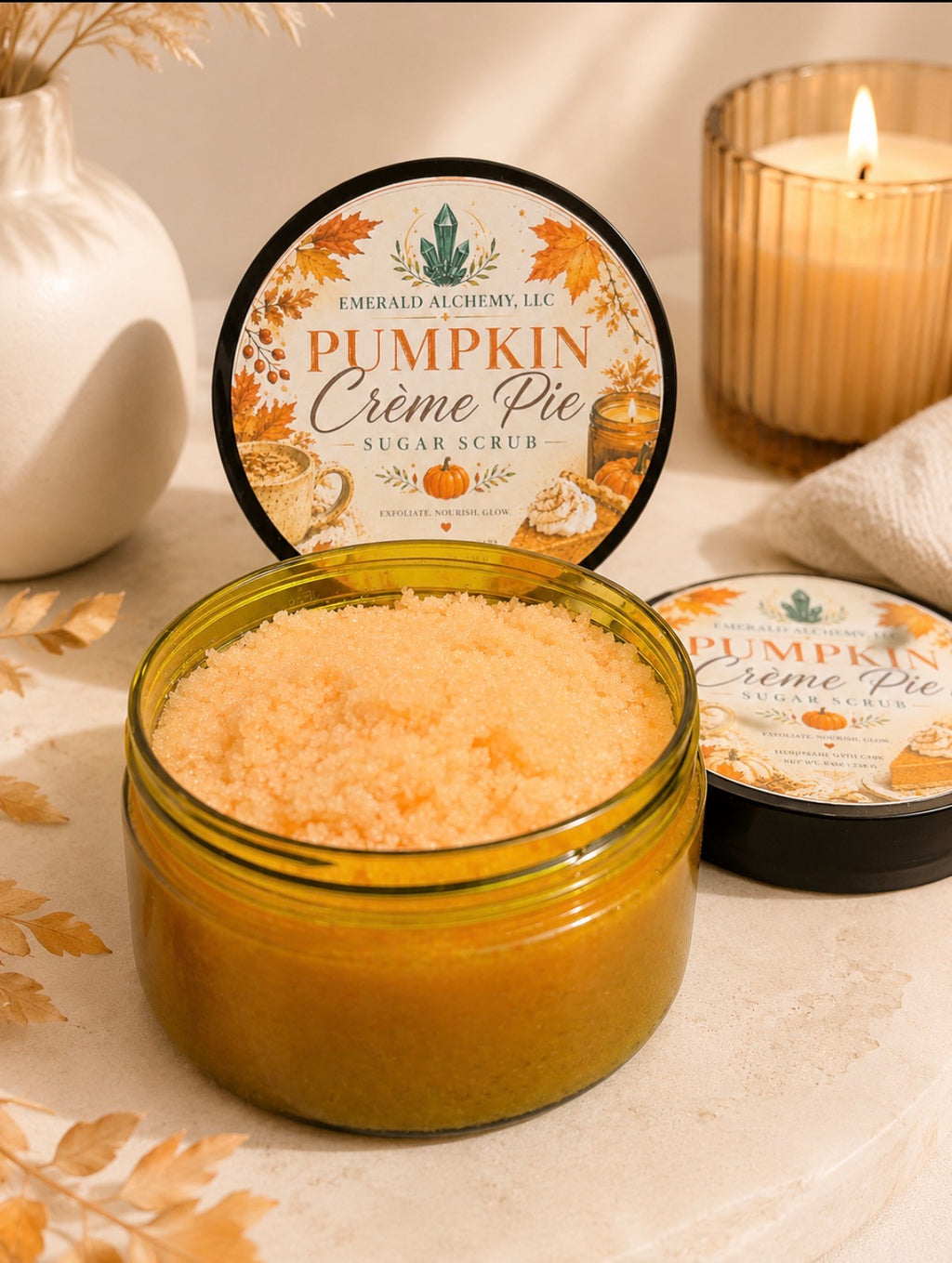Pumpkin Crème Pie Sugar Scrub 8 oz close-up with orange scrub, labeled lid, candle, and fall styling