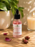 Unrefined Rosehip Oil in a 1 oz dropper bottle with rosehips and greenery
